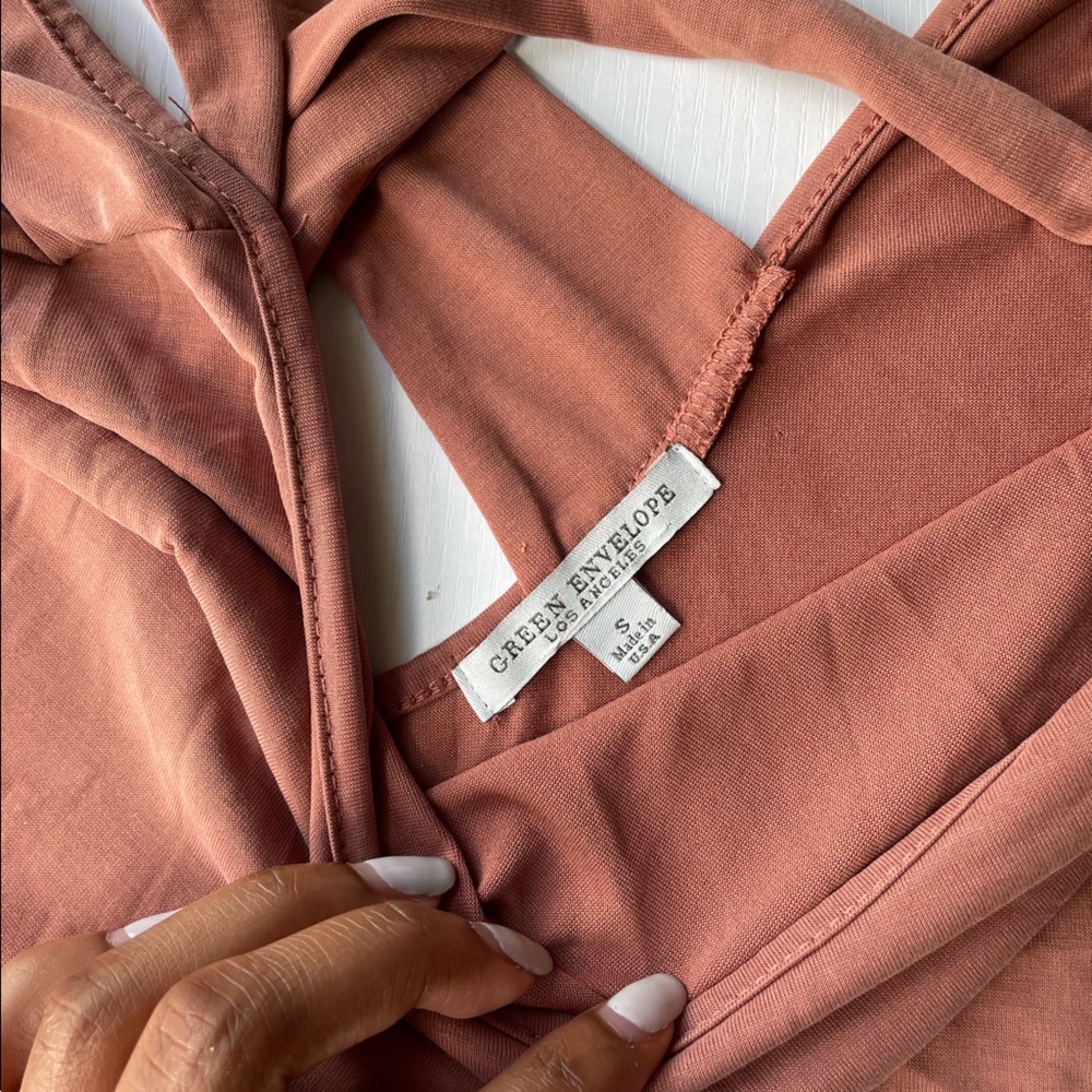 Has been worn once. Will be washed before shipped.